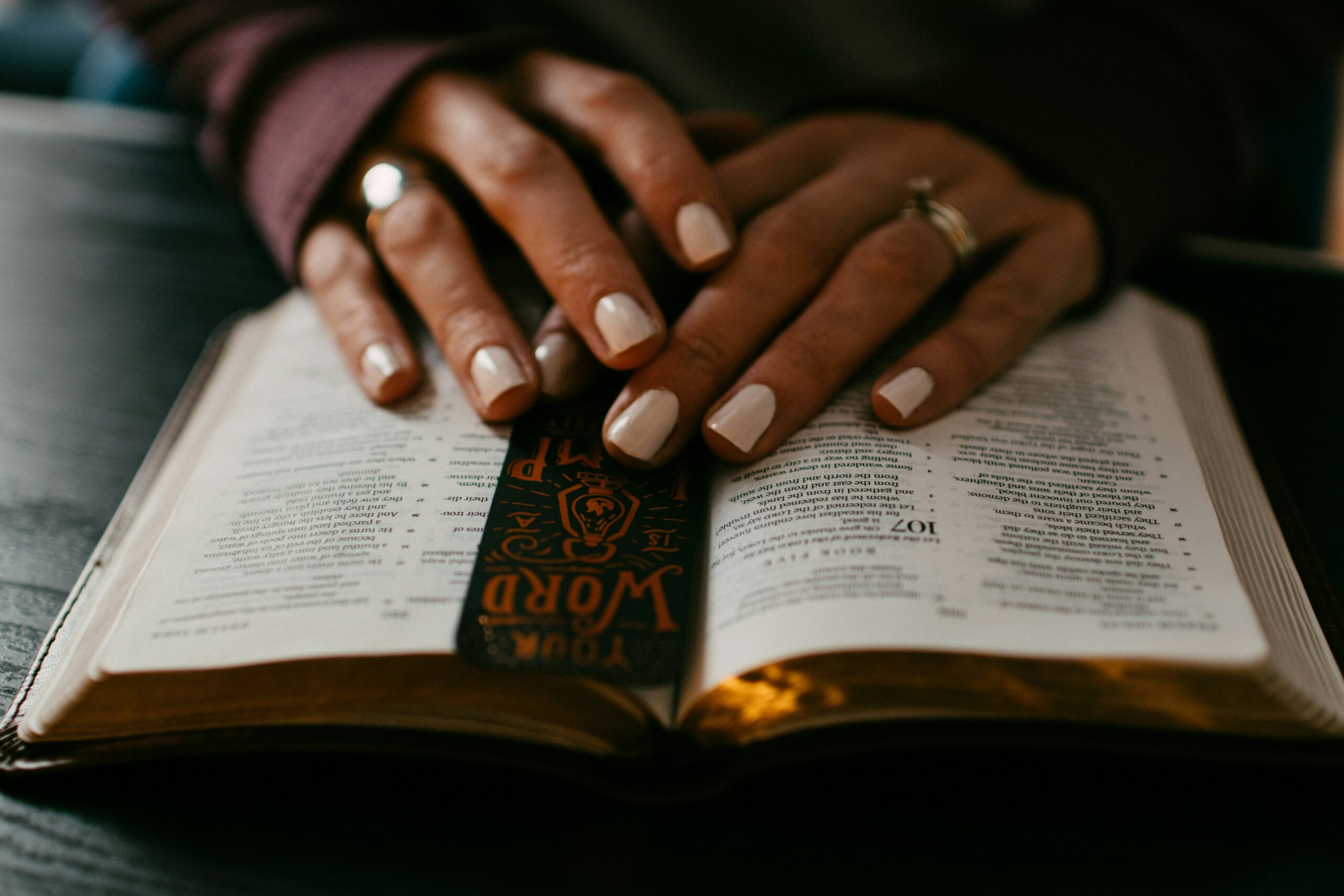 Woman in prayer with her Bible