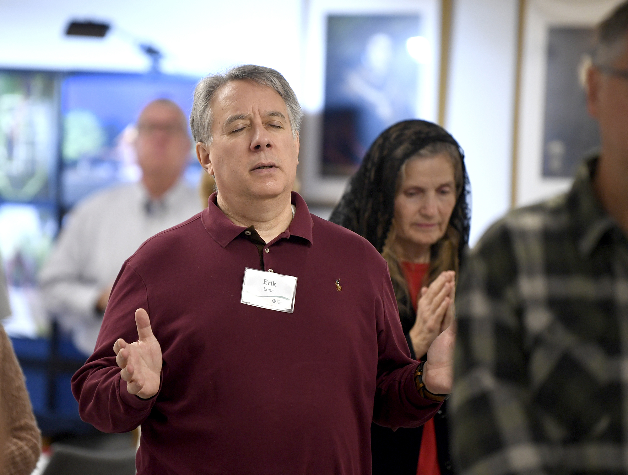 Man lifting hands up in prayer
