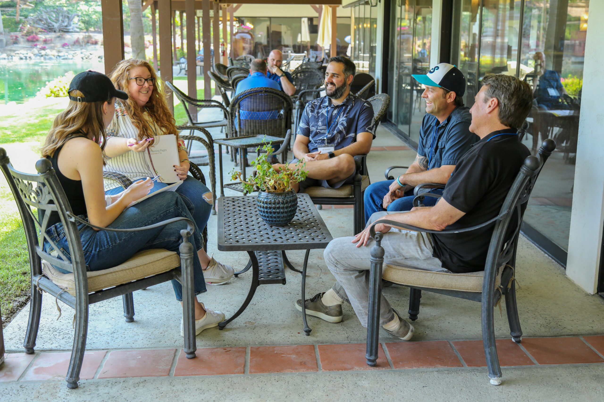 small group meeting outside store