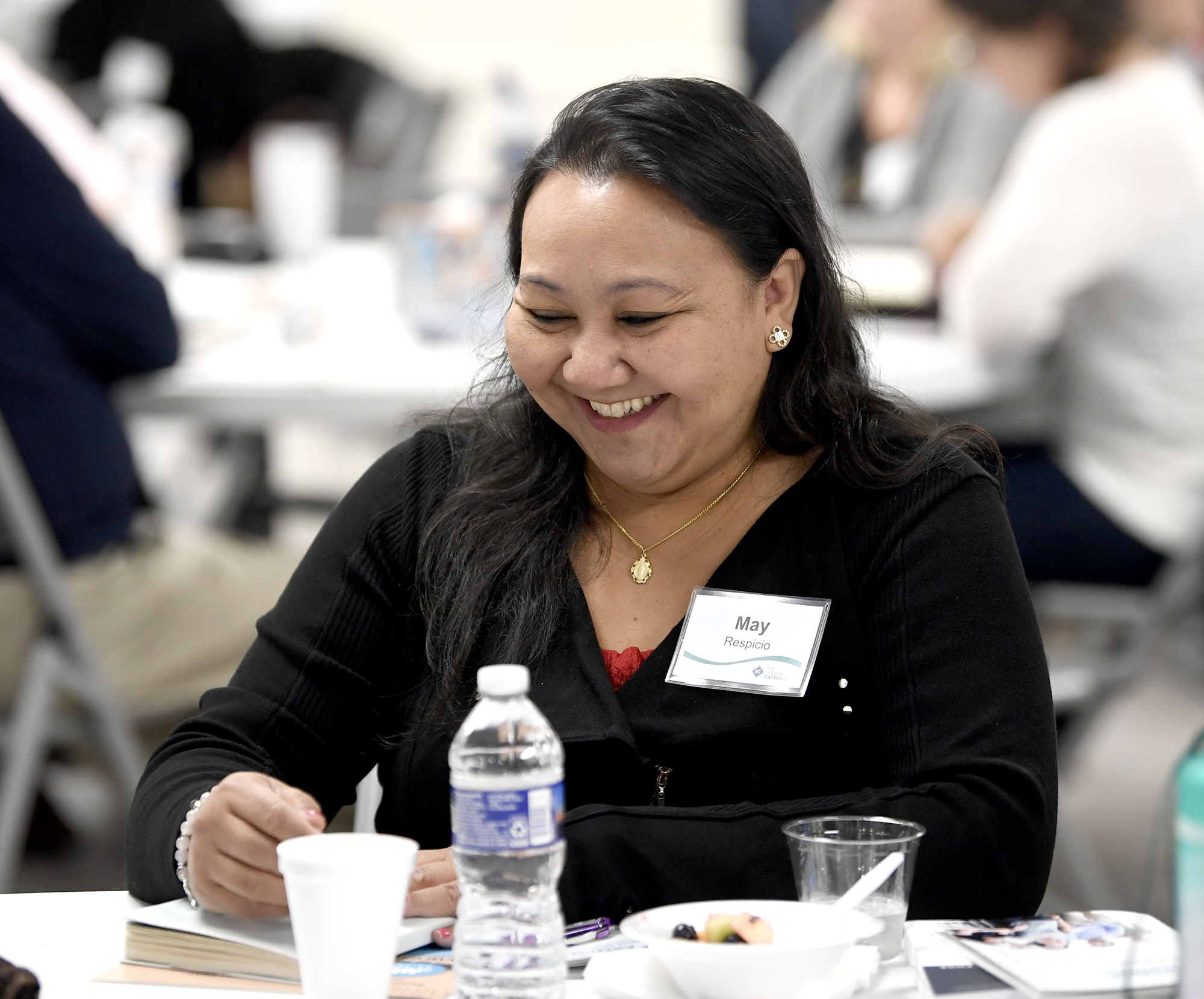 smiling woman at table